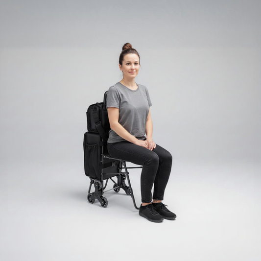 Artist sitting on the Moth Pro Station's fold-out seat, resting between setups