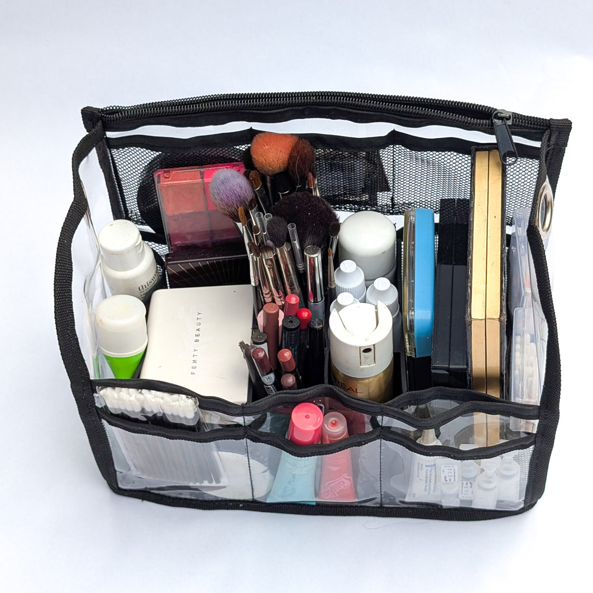 PVC insert for Moth Pro bag, wide interior view with multiple compartments packed with kit essentials