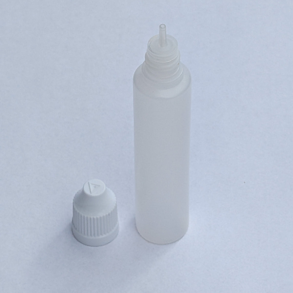 Long dropper bottle with cap removed, showing the fine nozzle tip