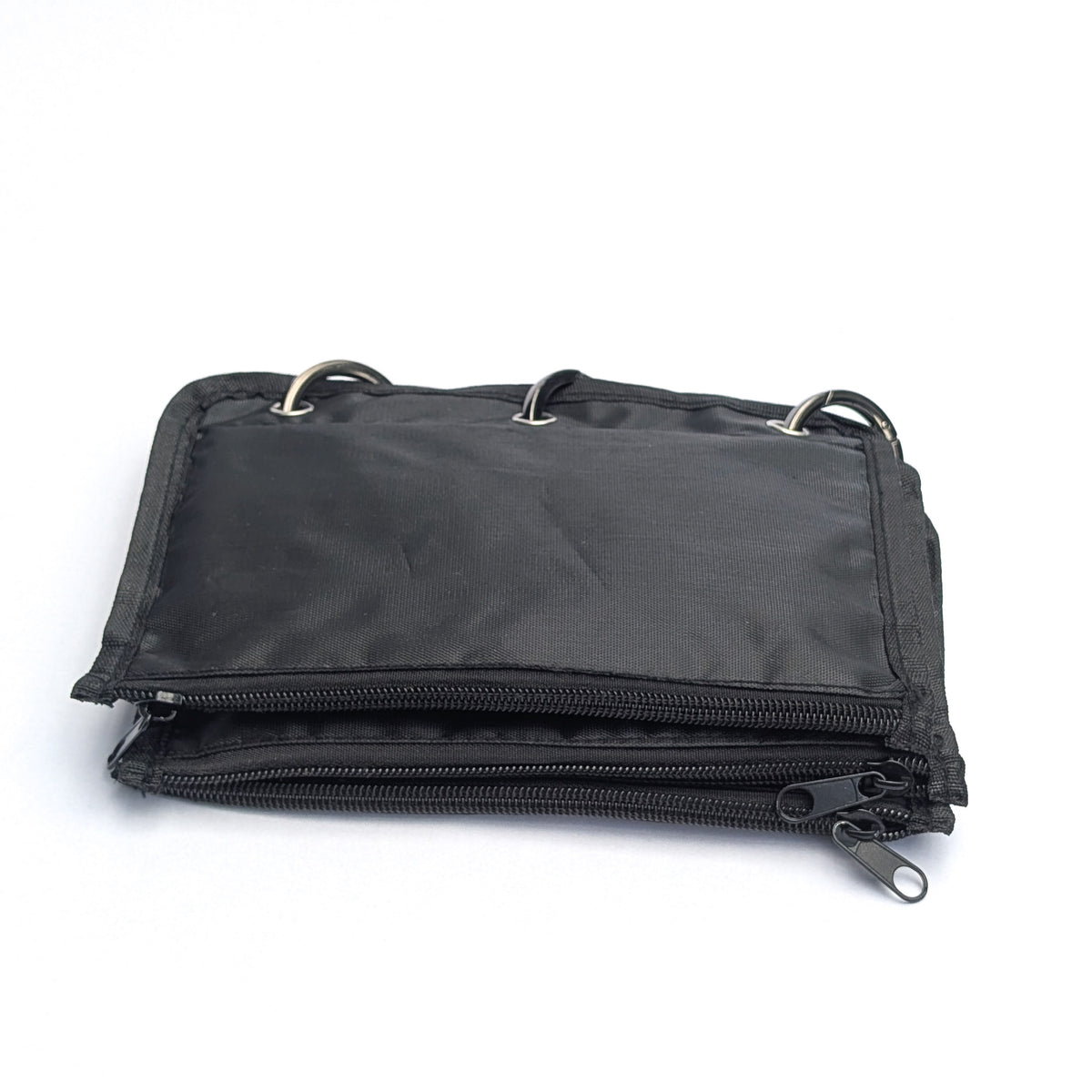 A black nylon zippered pouch with two silver metal D-rings on the top, shown on a plain white background.