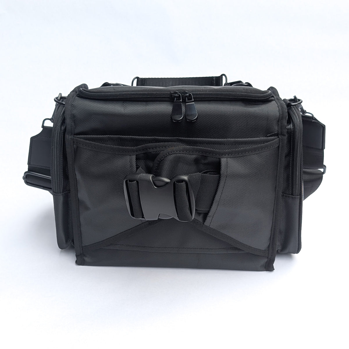 Moth Pro set bag with multiple zippered compartments, a front utility pocket, and adjustable straps, photographed on a clean white background.
