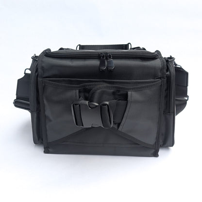 Moth Pro set bag with multiple zippered compartments, a front utility pocket, and adjustable straps, photographed on a clean white background.