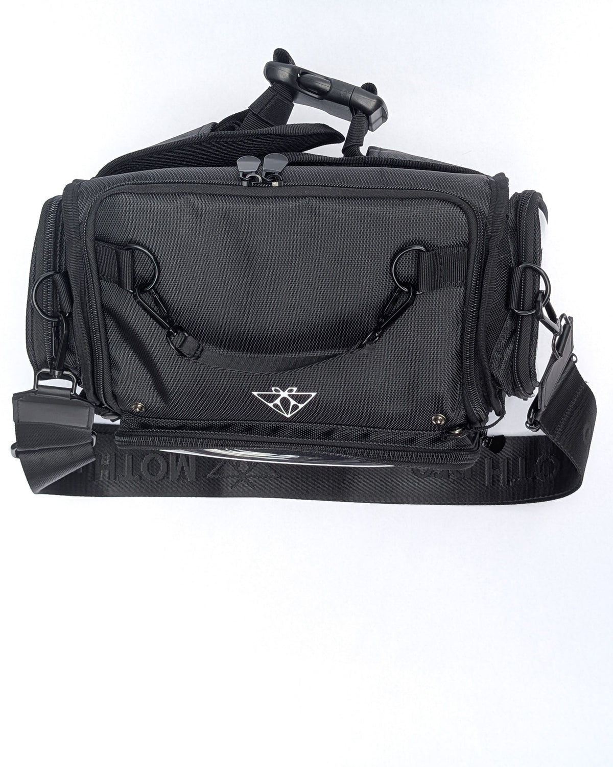 Moth Pro set bag with multiple zippered compartments, D-ring loops, and an adjustable shoulder strap, shown against a plain white background.