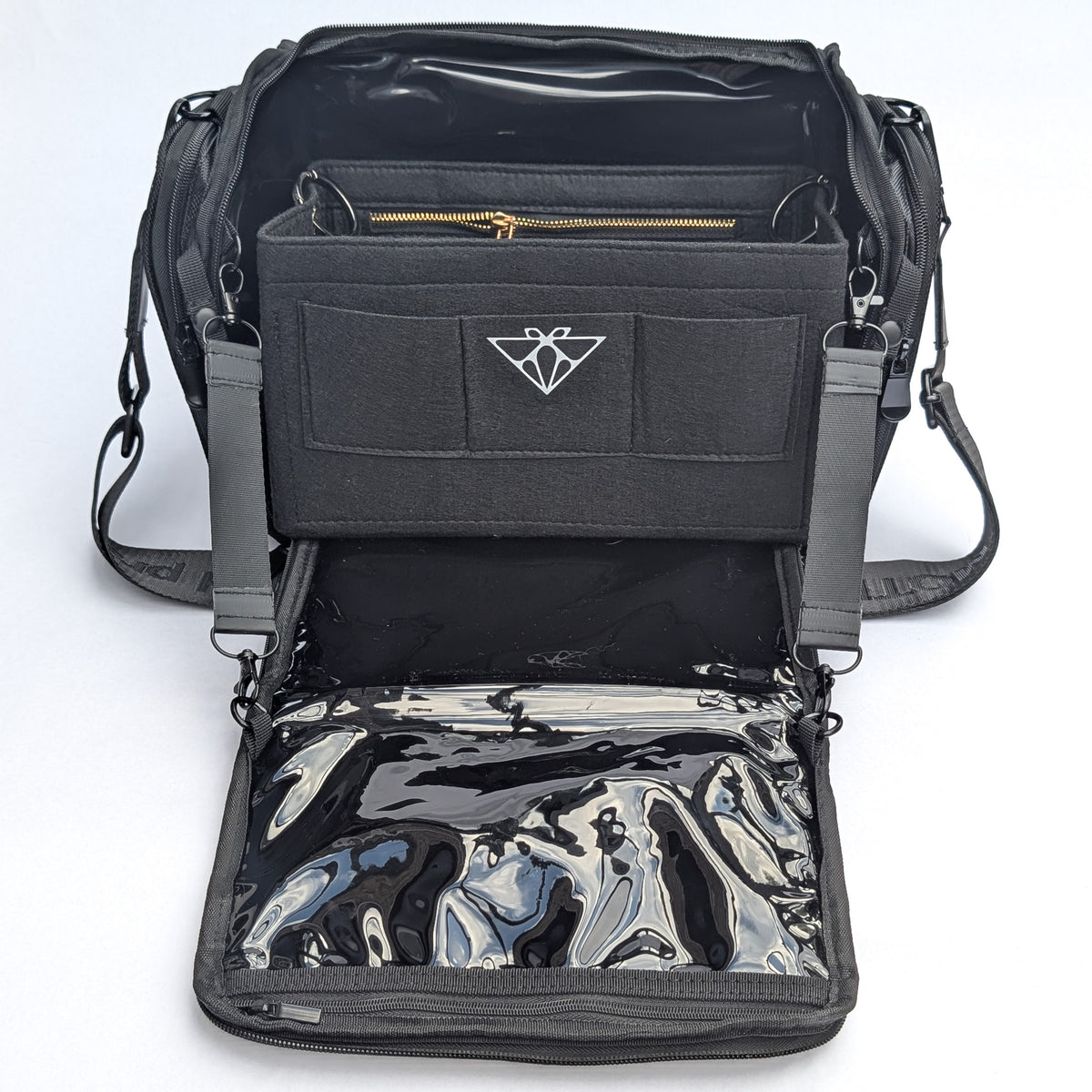 Moth Pro set bag with multiple compartments, adjustable shoulder straps, and a glossy black-and-silver reflective pouch inside, shown on a white background.