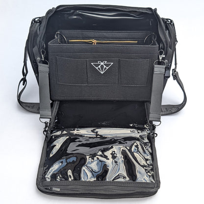 Moth Pro set bag with multiple compartments, adjustable shoulder straps, and a glossy black-and-silver reflective pouch inside, shown on a white background.